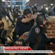 Police officers in Ferguson, Mo., crouch behind brick pillars after shots ring out early morning March 12, 2015, during a protest in front of police headquarters.
CBS News Screenshot